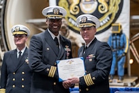 CAPT Jay Young presents CAPT (Sel) Kiah Rahming with the Navy Meritorious Service Medal for his incredible work as NEDU Commanding Officer.
