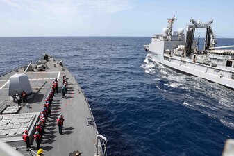 USS Ross (DDG 71), left, replenishes from the French navy replenishment ship FS Marne (A 630) in the Mediterranean Sea.