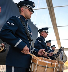 Air Force Airman 1st Class Austin Pierce, Band of the West percussionist, plays the drums during the National Medal of Honor Museum ceremony, March 25, 2022, at Arlington, Texas.