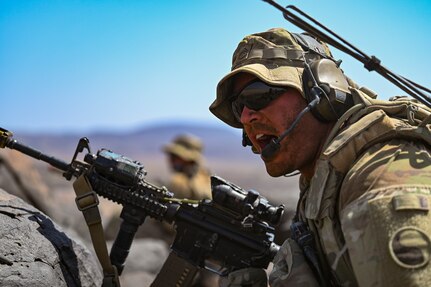 U.S. Army Staff Sgt. Chris Barksdale, a squad leader with the East Africa Response Force (EARF), Task Force Red Dragon, Combined Joint Task Force – Horn of Africa, commands his team during Exercise WAKRI 22 at Grand Bara, Djibouti, March 15, 2022. Exercise WAKRI 22, the largest annual French-led exercise on the African continent, was spread out across Djibouti and provided realistic training for French Armed Forces' air, ground and sea components alongside their U.S. allies.