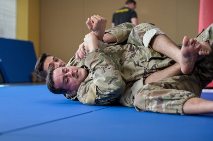 U.S. Air Force Tech. Sgt. Jose Marrero and Airman 1st Class Jonathan Milian, security forces journeymen with the 156th Security Operations Squadron, learned the basics of becoming a combatives instructor March 16, 2022, at Muñiz Air National Guard Base, Puerto Rico. Twenty-two Airmen participated in the 40-hour Air Force Combatives Program.