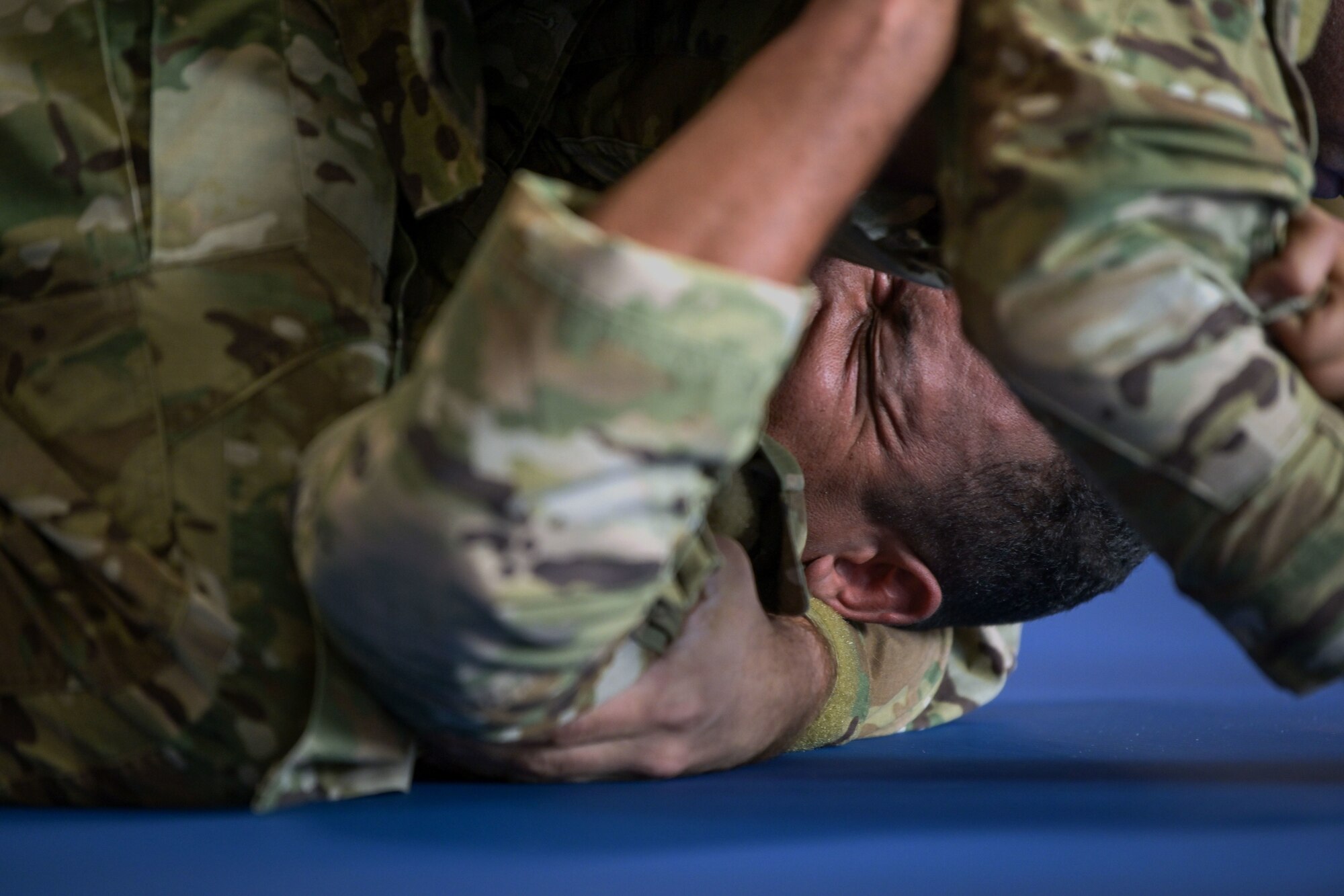 U.S. Air Force Staff Sgt. Irvin Morales, a Security Forces craftsman, with the 156th Security Forces Squadron, is held down in the front mount non dominant position during a live role exercise, March 17, 2022 at Muñiz Air National Guard Base, Puerto Rico. The 40 hour Air Force Combatives Program allowed the 22 Airmen that participated, to experience close quarters hand to hand combat and train in various scenarios against an opponent. (U.S. Air National Guard photo by Master Sgt. Rafael D. Rosa)