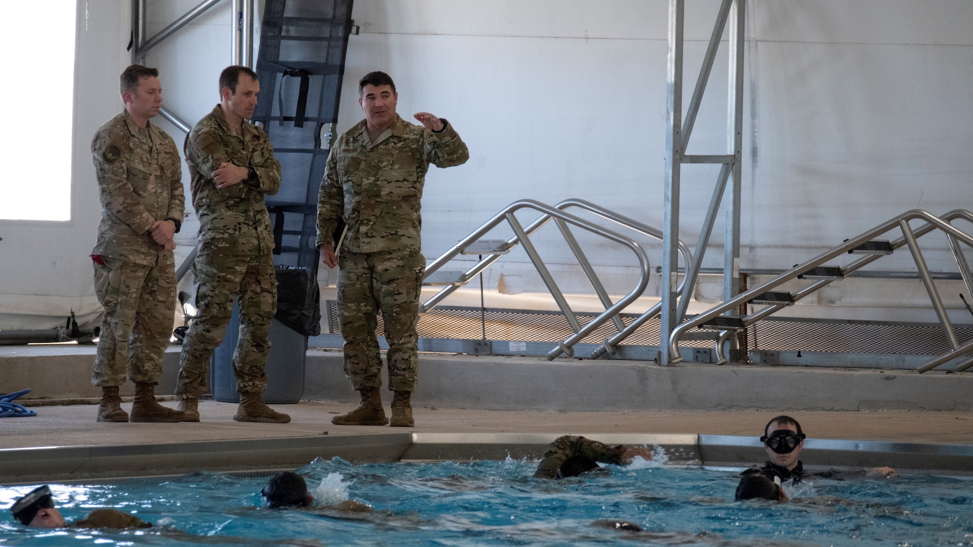 U.S. Air Force Maj. Gen. Matthew Davidson (right), Air Force Special Operations Command director of operations, observes Assessment and Selection at Chaparral Pool on Joint Base San Antonio-Lackland, Texas, Mar. 15, 2022. One third of graduates from the Special Warfare Training Wing pipelines will feed directly into operational AFSOC units, to include Combat Controllers, Special Reconnaissance Airmen, Special Tactics Officers, and some Pararescuemen.