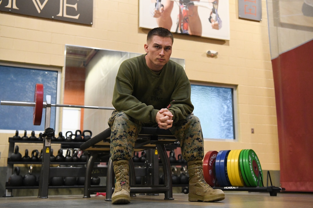 Sgt. Randy Rhodes sits on the bench in between his bench press sets on Camp Lejeune, N.C., Mar. 10, 2022. Rhodes, a recovering service member, has completed over 140 book reports from the Commandant's Professional Reading List during his time at Wounded Warrior Battalion-East.