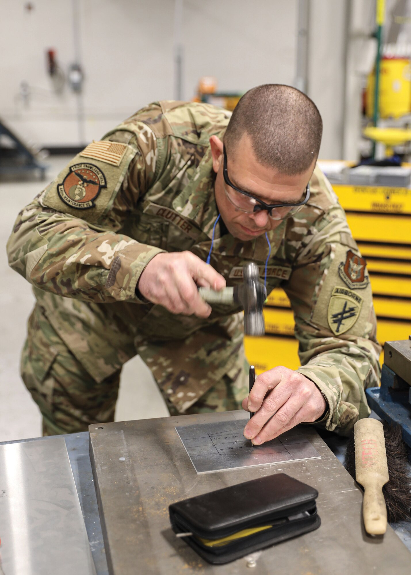 Tech. Sgt. Calvin J. Clutter, an aircraft structural maintenance technician with the 445th Maintenance Squadron’s Fabrication Shop, manufactures an oxygen box bracket for a C-17 Globemaster III aircraft, March 12, 2022. This bracket, though small in size, will eventually go on to be a part of the complex oxygen delivery system on a C-17. The fabrication shop uses a variety of machines to create, repair, or replace parts on the aircraft providing behind the scenes support that is vital to aircraft functionality.