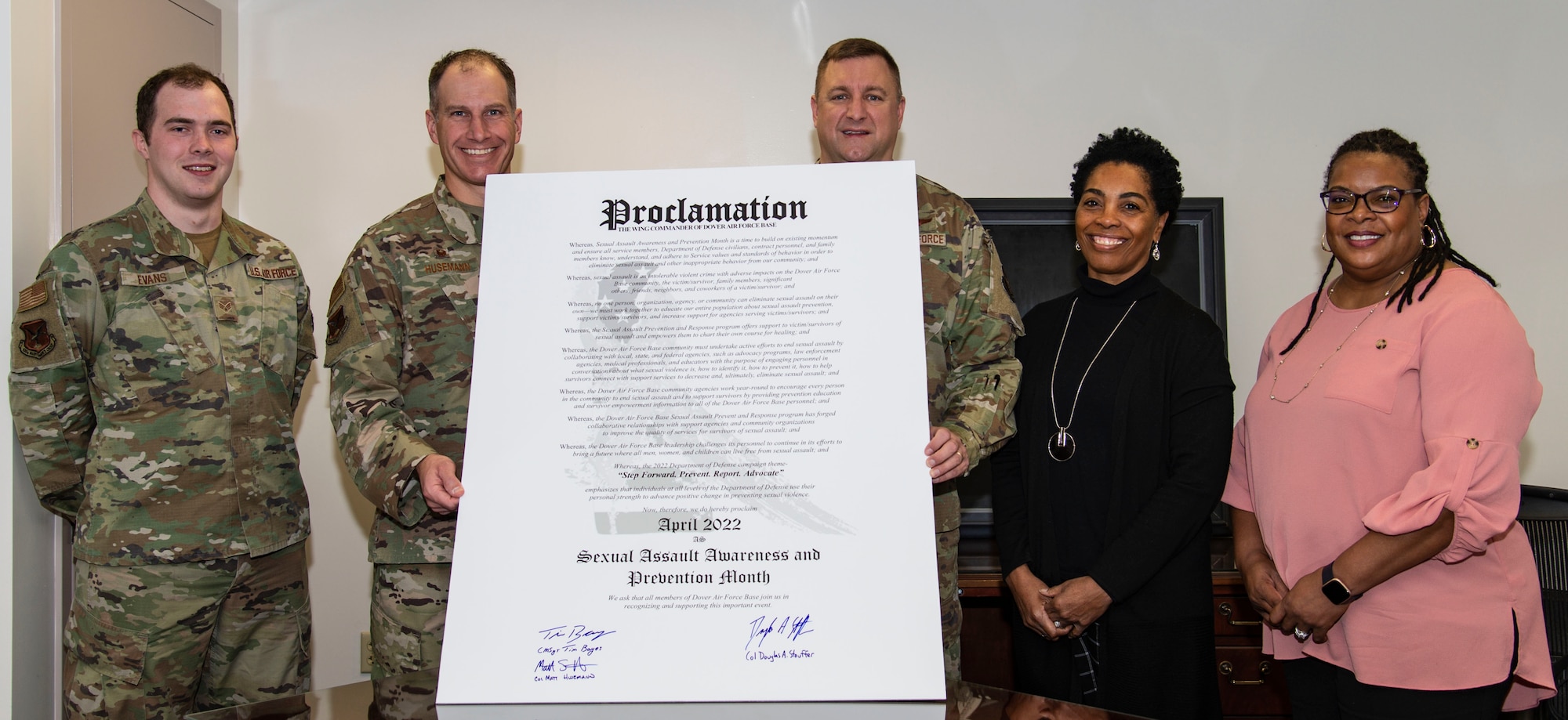 From the left, Senior Airman Devin Evans, 436th Maintenance Group volunteer victim advocate; Col. Matt Husemann, 436th Airlift Wing commander; Col. Doug Stouffer, 512th AW commander; Gail Reed-Attoh, 436th AW sexual assault response coordinator; and Kimberly McGill, 436th Civil Engineer Squadron volunteer victim advocate, stand by the 2022 Sexual Assault Awareness Month proclamation at Dover Air Force Base, Delaware, March 14, 2022. Husemann, Stouffer and other Dover AFB senior leadership also signed the proclamation to support SAAM in April. (U.S. Air Force photo by Roland Balik)