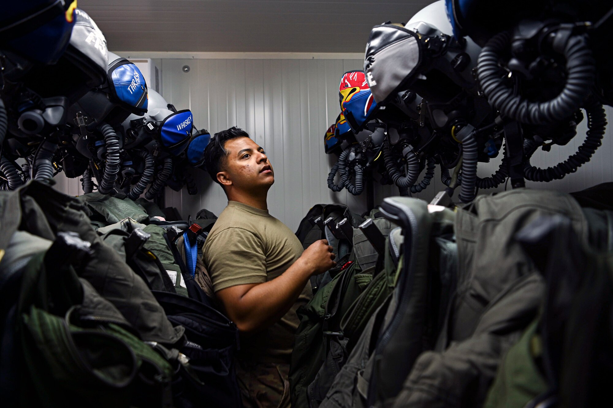 A 492nd Fighter Squadron aircrew flight equipment technician, performs inspections of flight equipment