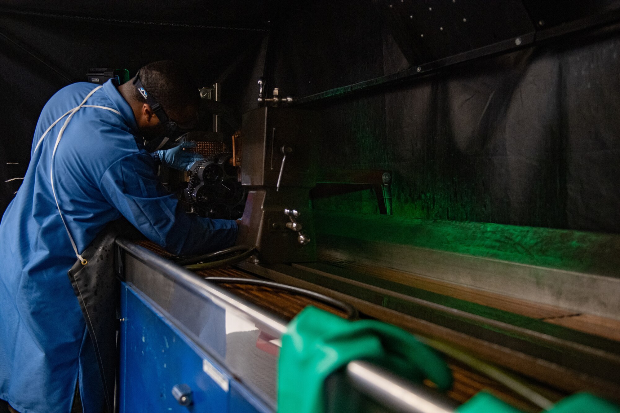 U.S. Air Force Airman 1st Class Jamorris Lewis, a 23rd Maintenance Squadron nondestructive inspection apprentice, repositions an A-10 Thunderbolt II GAU-8 weapons system part during a magnetic particle inspection at Moody Air Force Base, Georgia, April 5, 2022. A magnetic particle inspection reveals any surface and subsurface defects of magnetic metal items. (U.S. Air Force photo by Staff Sgt. Melanie A. Bulow-Gonterman)