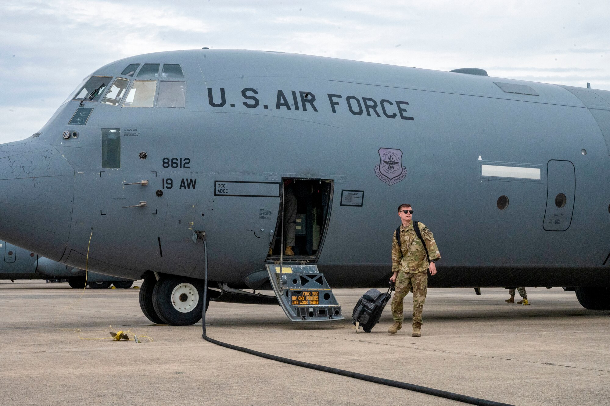 An Airman from the 19th Airlift Wing departs a C-130J Super Hercules at Little Rock Air Force Base, Arkansas, after returning from a deployment
