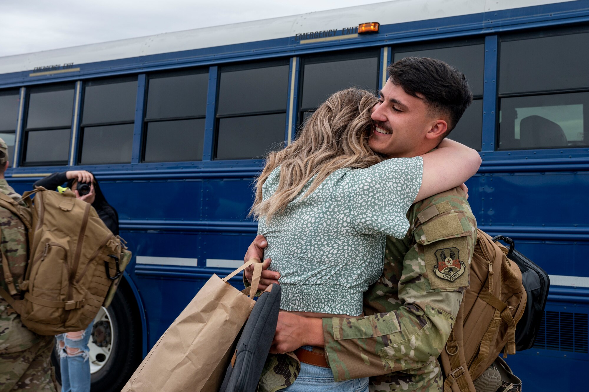An Airman from the 19th Airlift Wing reunites with a loved one at Little Rock Air Force Base, Arkansas, after returning from a deployment