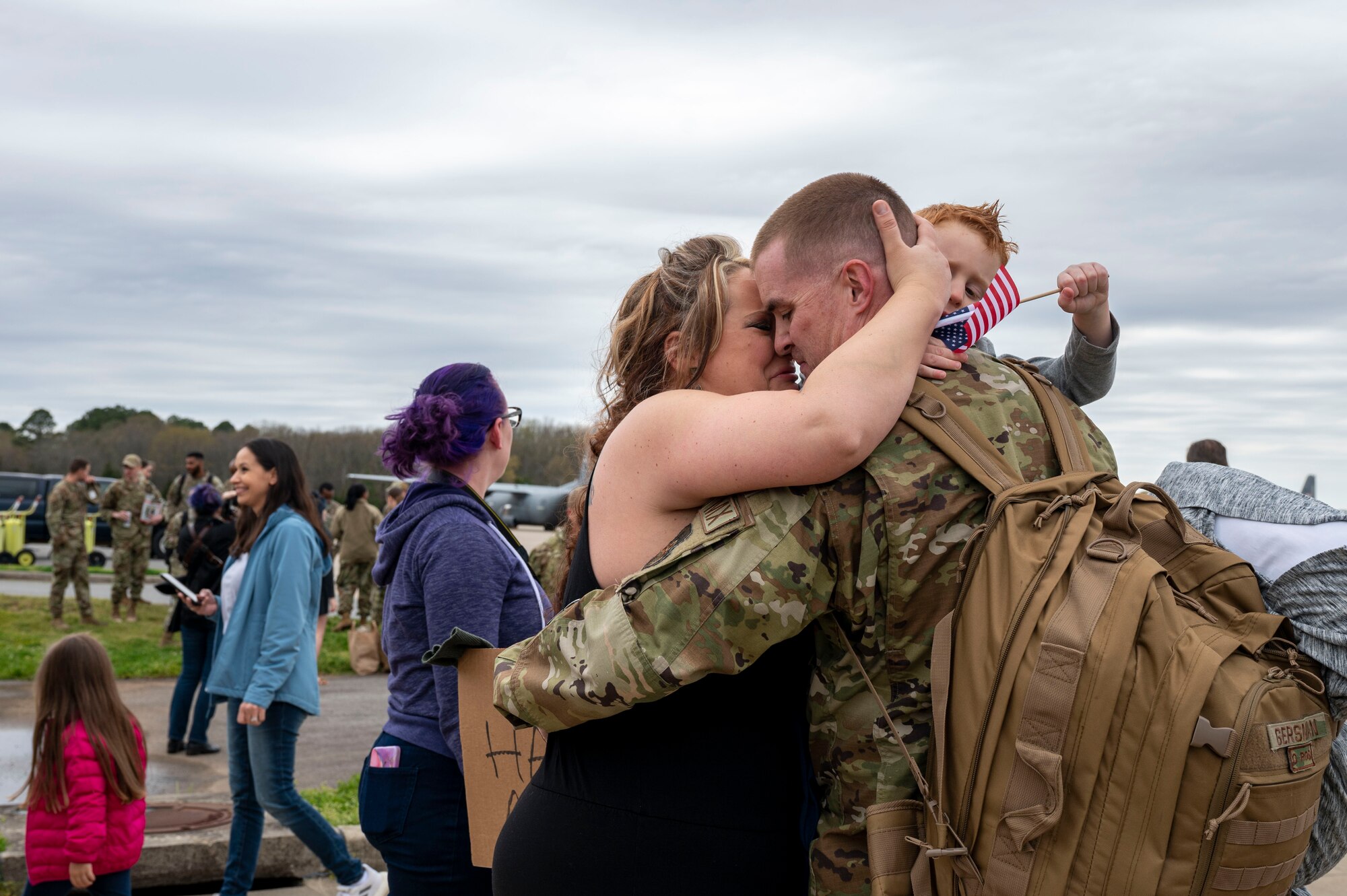An Airman from the 19th Airlift Wing reunites with his family at Little Rock Air Force Base, Arkansas, after returning from a deployment