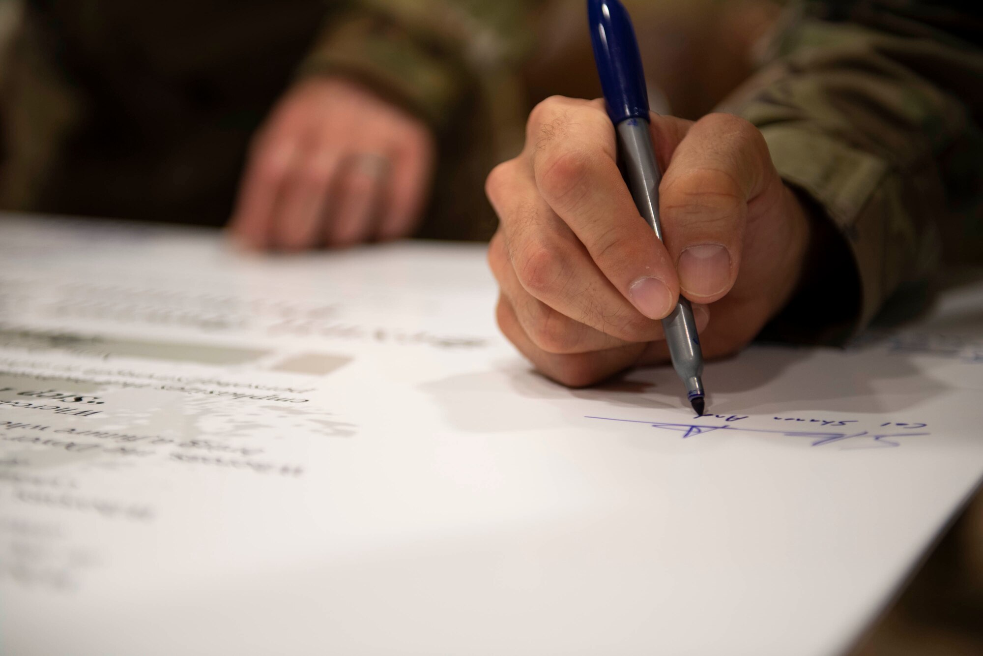 Col. Shanon Anderson, 436th Airlift Wing vice commander, signs the Sexual Assault Awareness Month proclamation at Dover Air Force Base, Delaware, April 1, 2022. Anderson, along with other Dover AFB senior leaders, signed the proclamation to support SAAM in April. (U.S. Air Force photo by Tech. Sgt. J.D. Strong II)