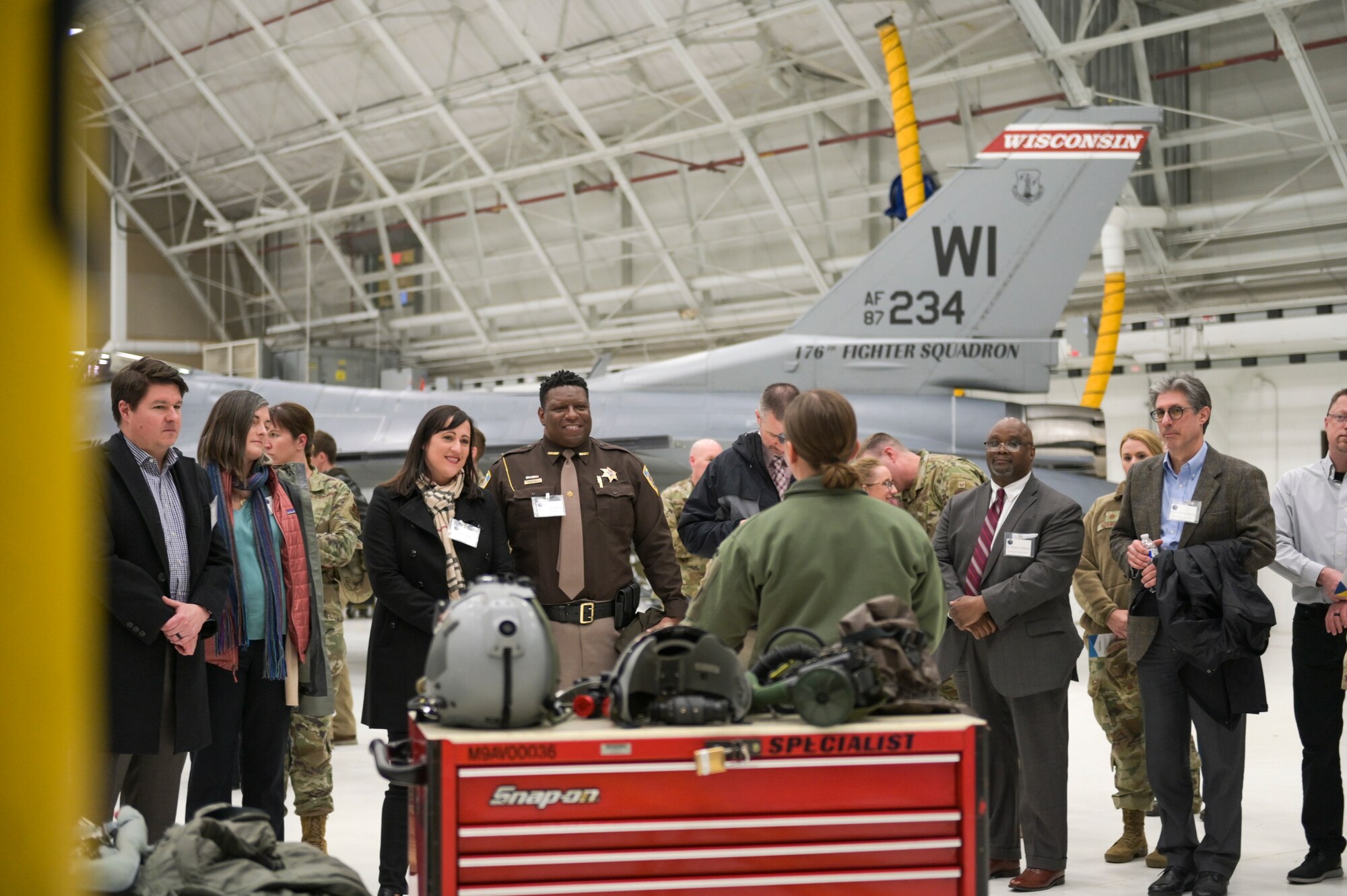 Local community leaders tour the 115th Fighter Wing, Madison, Wisconsin April 6, 2022 during an event commemorating their new role as Honorary Commanders. The Honorary Commander Program was developed to allow local community and business leaders and opportunity to gain insight into the fighter wing's mission and overall U.S. Air Force way of life. (U.S. Air National Guard photo by Staff Sgt. Cameron Lewis)