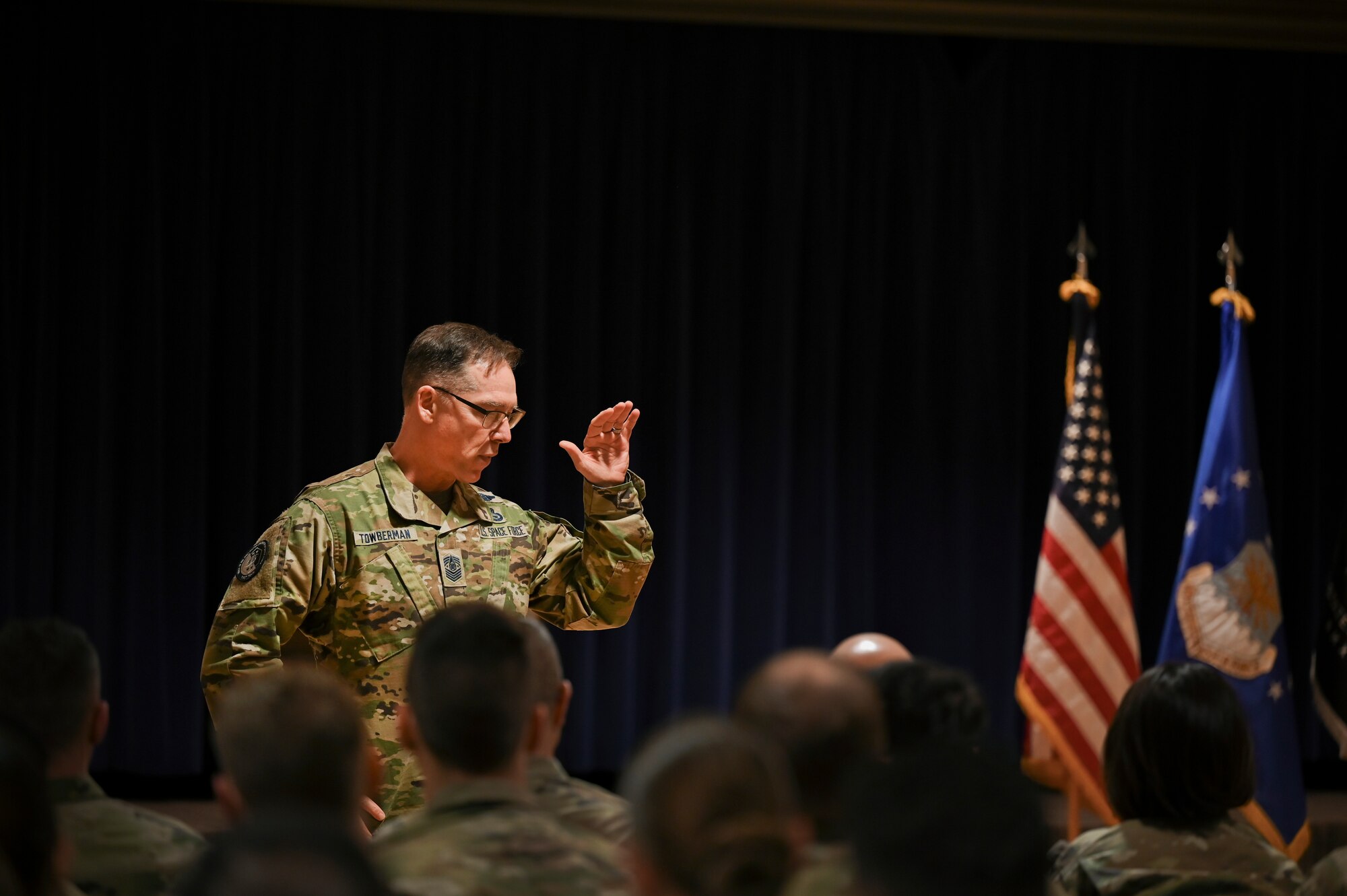 Chief Master Sgt. of the Space Force Roger A. Towberman discusses the future of uniform availability during an all-call at Peterson Space Force Base, Colorado, April 7, 2021. Towberman visited both Peterson and Schriever Space Force Base to answer any questions such as the future of the USSF promotion structure and retention. (U.S. Space Force photo by Senior Airman Andrew Bertain)