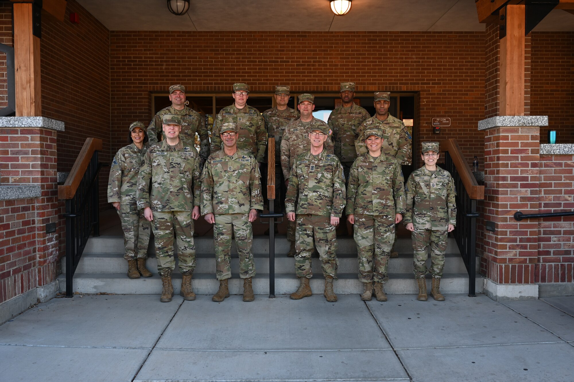 Senior Enlisted Leaders from around the U.S. Space Force and Peterson- Schriever Garrison greet Chief Master Sgt. of the Space Force Roger A. Towberman, before he engages in a town hall at Peterson Space Force Base, Colorado, April 7, 2022. Towberman spoke at both Peterson and Schriever Space Force Bases answering questions from Airmen and Guardians concerning the future of the USSF. (U.S. Space Force photo by Senior Airman Andrew Bertain)