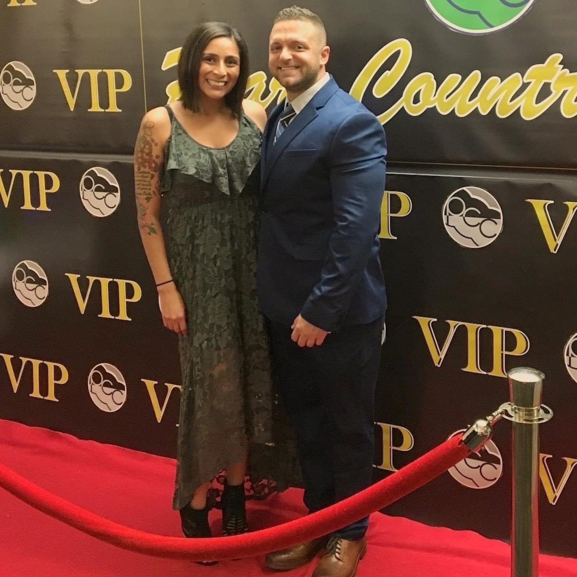 A couple poses for a photo