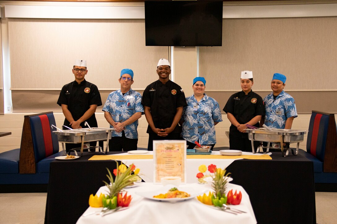 The competitors of the Chef of the Quarter competition pose for a photo, Marine Corps Base Hawaii, April 1, 2022. Chef of the Quarter competitions allow an opportunity for food service specialists to hone their craft, while fostering competition and esprit de corps. (U.S. Marine Corps photo by Cpl. Samantha Sanchez)