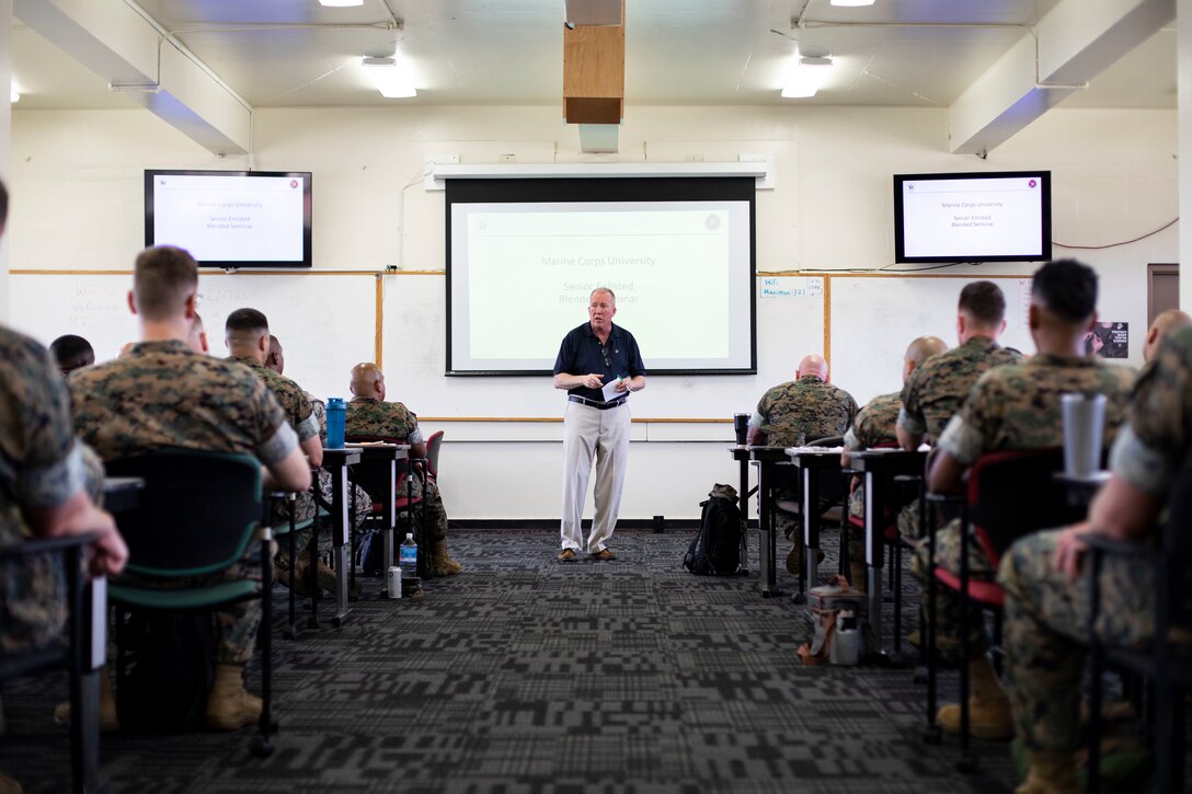 Retired U.S. Marine Corps Col. Terence Kerrigan, director, College of Distance Education and Training, Marine Corps University, Quantico, speaks during the Senior Enlisted Education Symposium, Marine Corps Base Hawaii, April 4, 2022. The Senior Enlisted Education Symposium was conducted in order to educate on leadership styles and to prepare senior leaders for future promotions. (U.S. Marine Corps photo by Cpl. Samantha Sanchez)