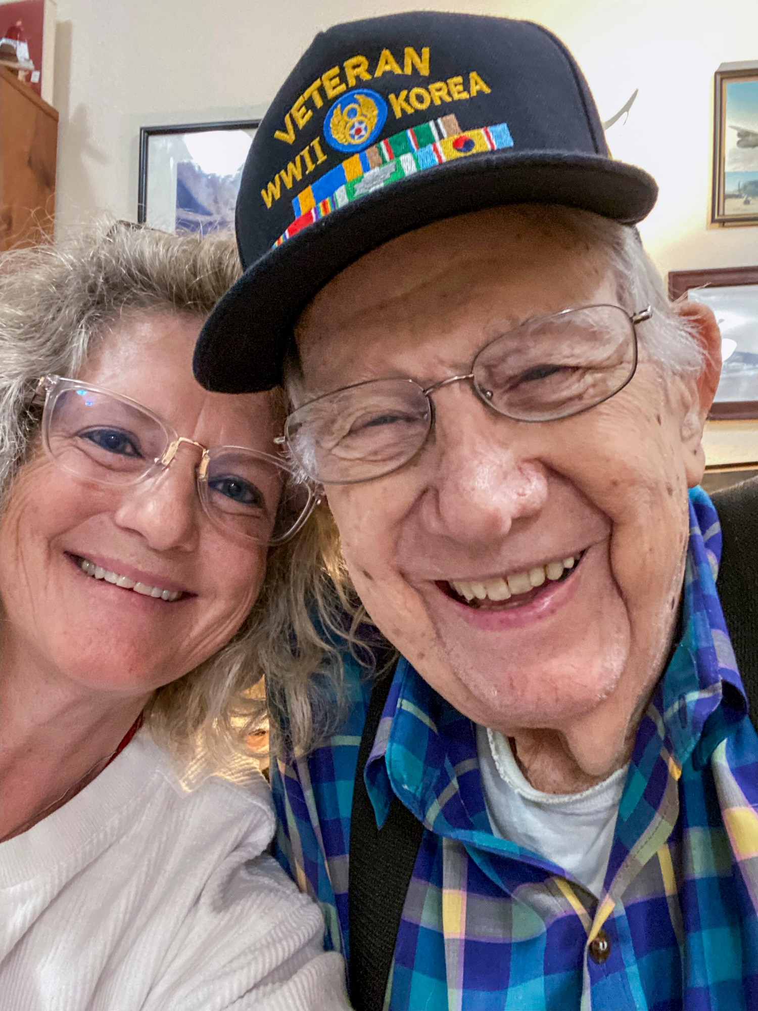 a man and woman pose together