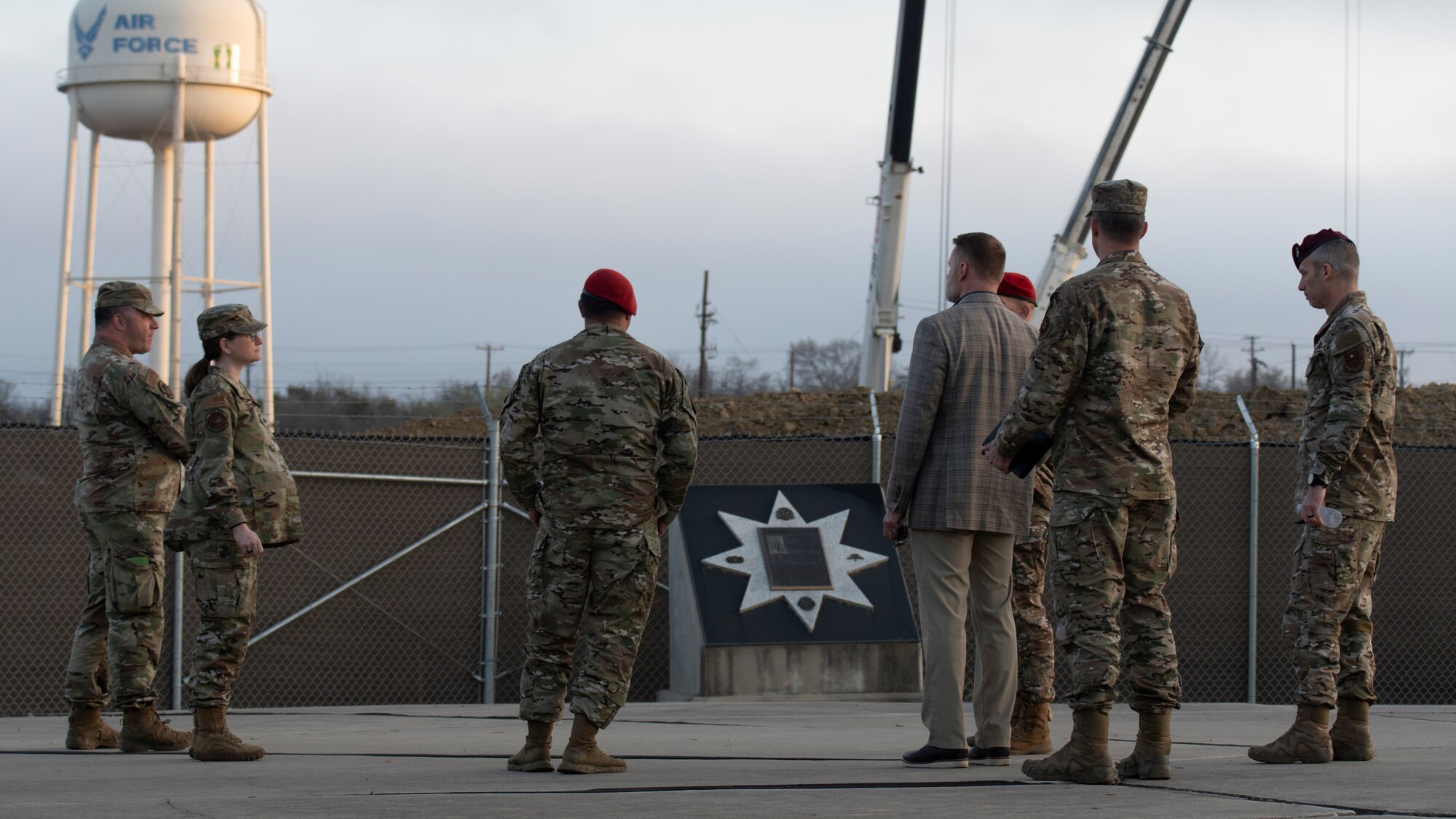 U.S. Air Force Maj. Gen. Matthew Davidson (center), Air Force Special Operations Command director of operations, receives a tour of the Special Warfare Training Wing memorial site overlooking the construction site of a new, $66.6M aquatics training facility that will accommodate training for over 3,000 Air Force Special Warfare trainees annually when complete on Joint Base San Antonio-Chapman Training Annex, Texas, Mar. 17, 2022. Maj. Gen. Davidson visited the SWTW to observe Assessment and Selection and the SWTW pipelines that feed AFSOC career fields.