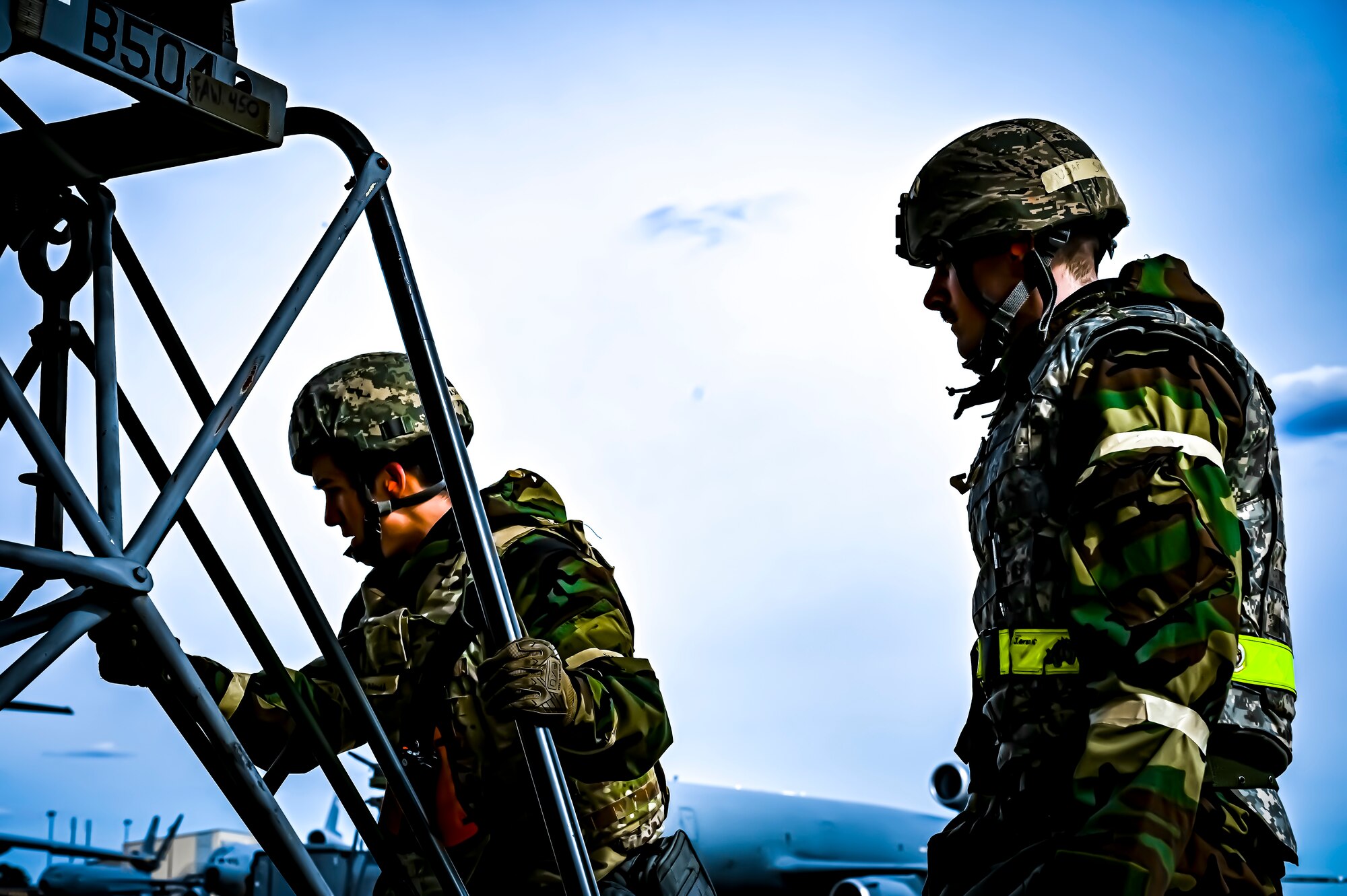 U.S. Air Force Airmen from the 305th Air Mobility Wing wearing mission oriented protective posture gear prepare to upload maintenance equipment onto a C-17 Globemaster III, demonstrating the ability to survive and operate in a contested environment during a readiness exercise at Joint Base McGuire-Dix-Lakehurst, New Jersey, Apr. 4, 2022. Training exercises reinforce Airmen readiness and deliberately strengthen Air Mobility Command’s warfighting culture in order to provide unrivaled Rapid Global Mobility capable of protecting and sustaining the Joint Force.