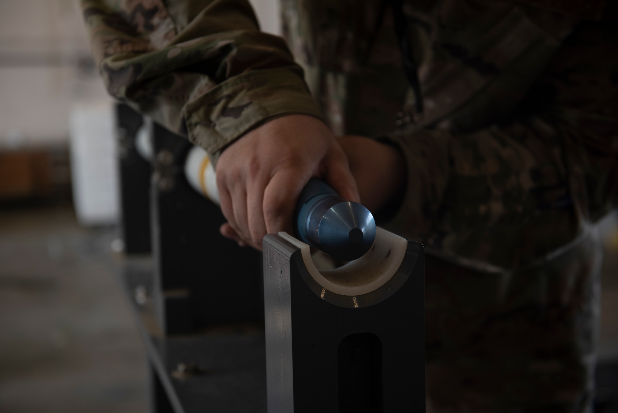 A photo of a person holding a warhead.