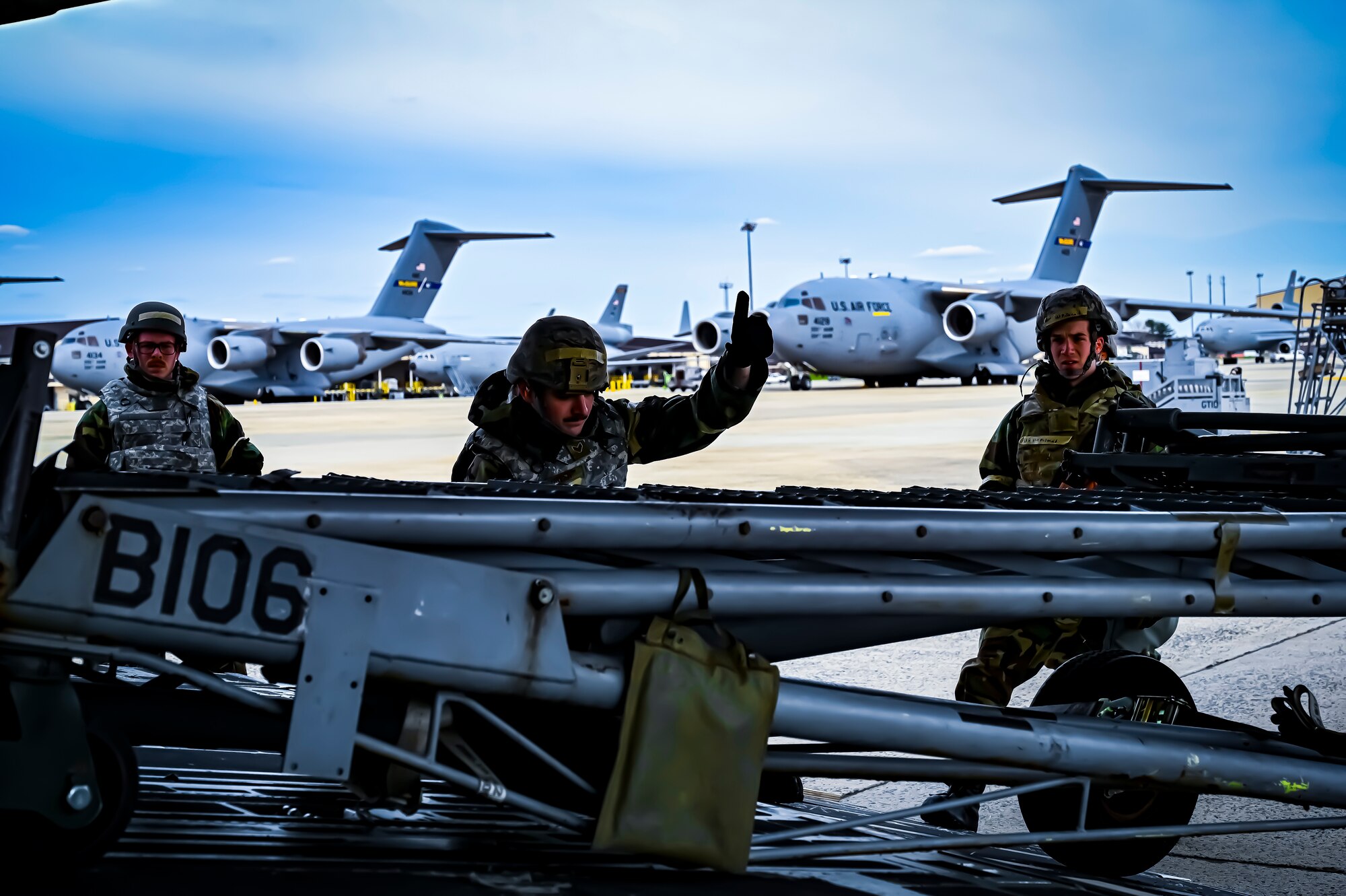 U.S. Air Force Airmen from the 305th Air Mobility Wing wearing mission oriented protective posture gear prepare to upload maintenance equipment onto a C-17 Globemaster III, demonstrating the ability to survive and operate in a contested environment during a readiness exercise at Joint Base McGuire-Dix-Lakehurst, New Jersey, Apr. 4, 2022. Training exercises reinforce Airmen readiness and deliberately strengthen Air Mobility Command’s warfighting culture in order to provide unrivaled Rapid Global Mobility capable of protecting and sustaining the Joint Force.