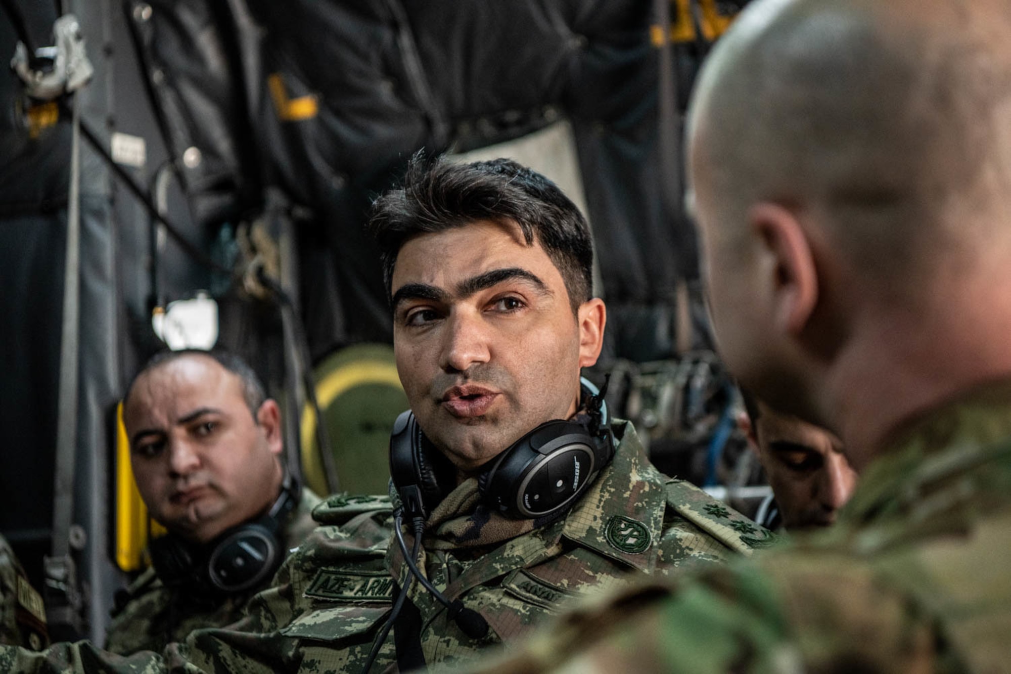 Azerbaijan troop talks to an Airman