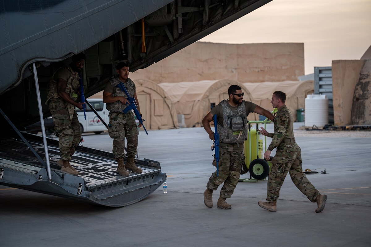 Senior Airman Cameron Blackburn, 801st Expeditionary Maintenance Squadron aerial recovery journeyman, responds to a simulated threat during airfield security operations training at an undisclosed location in Southwest Asia, April 5, 2022. The training focused on small team perimeter security, personnel placement for aircraft defense, and basic defense postures. (U.S. Air Force photo by Master Sgt. Christopher Parr)