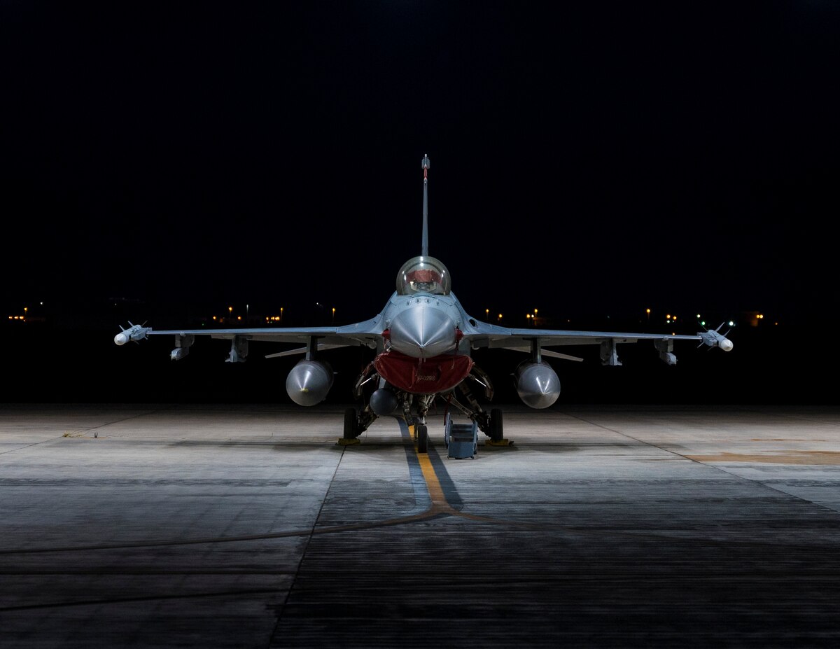 A U.S. Air Force F-16 Fighting Falcon assigned to the 120th Expeditionary Fighter Squadron sits on the flight line