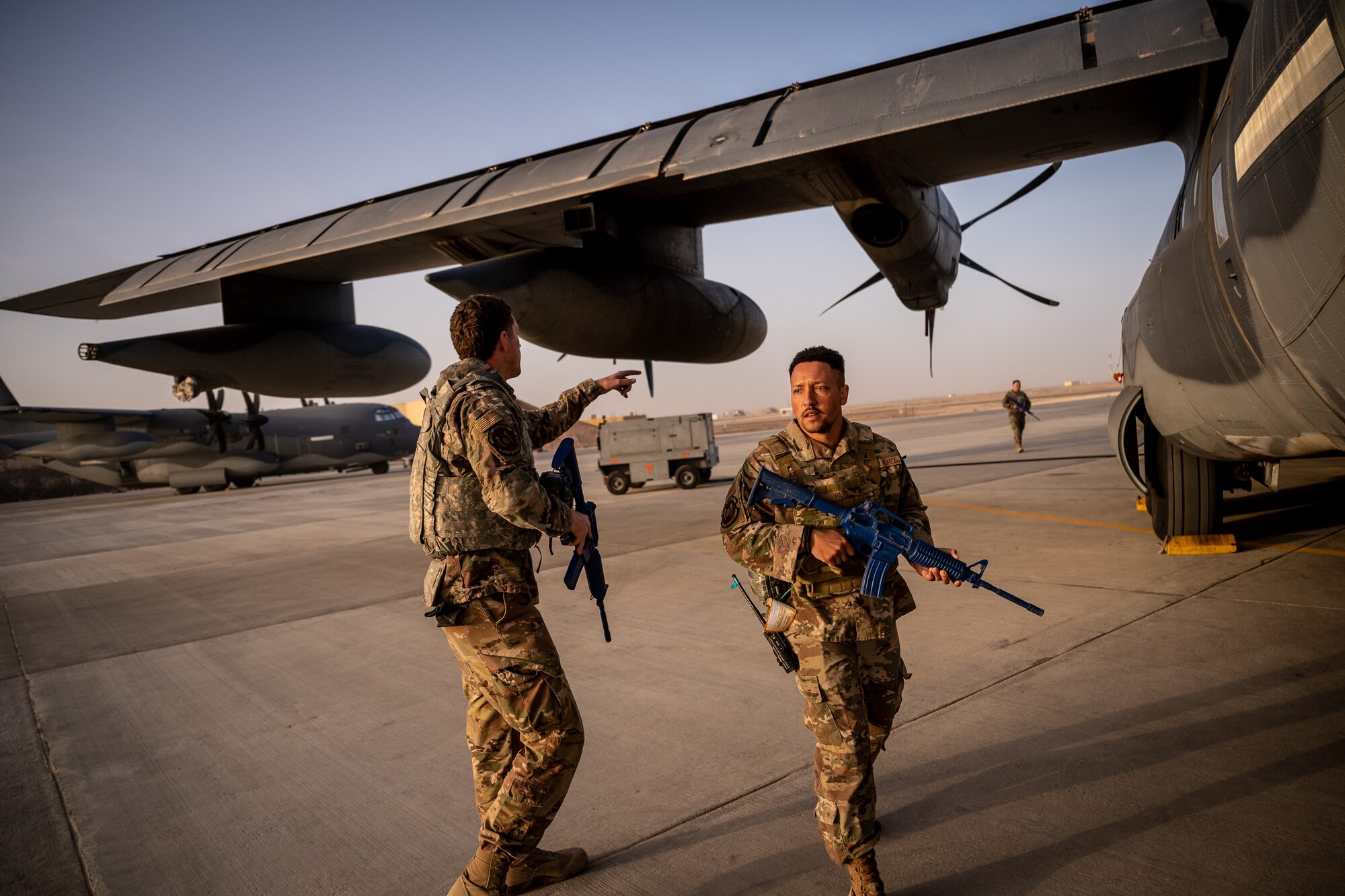 Airmen from the 801st Expeditionary Maintenance Squadron respond to simulated threats during airfield security operations training led by the 332d Expeditionary Security Forces Squadron at an undisclosed location in Southwest Asia, April 5, 2022. The training focused on small team perimeter security, personnel placement for aircraft defense, and basic defense postures. (U.S. Air Force photo by Master Sgt. Christopher Parr)