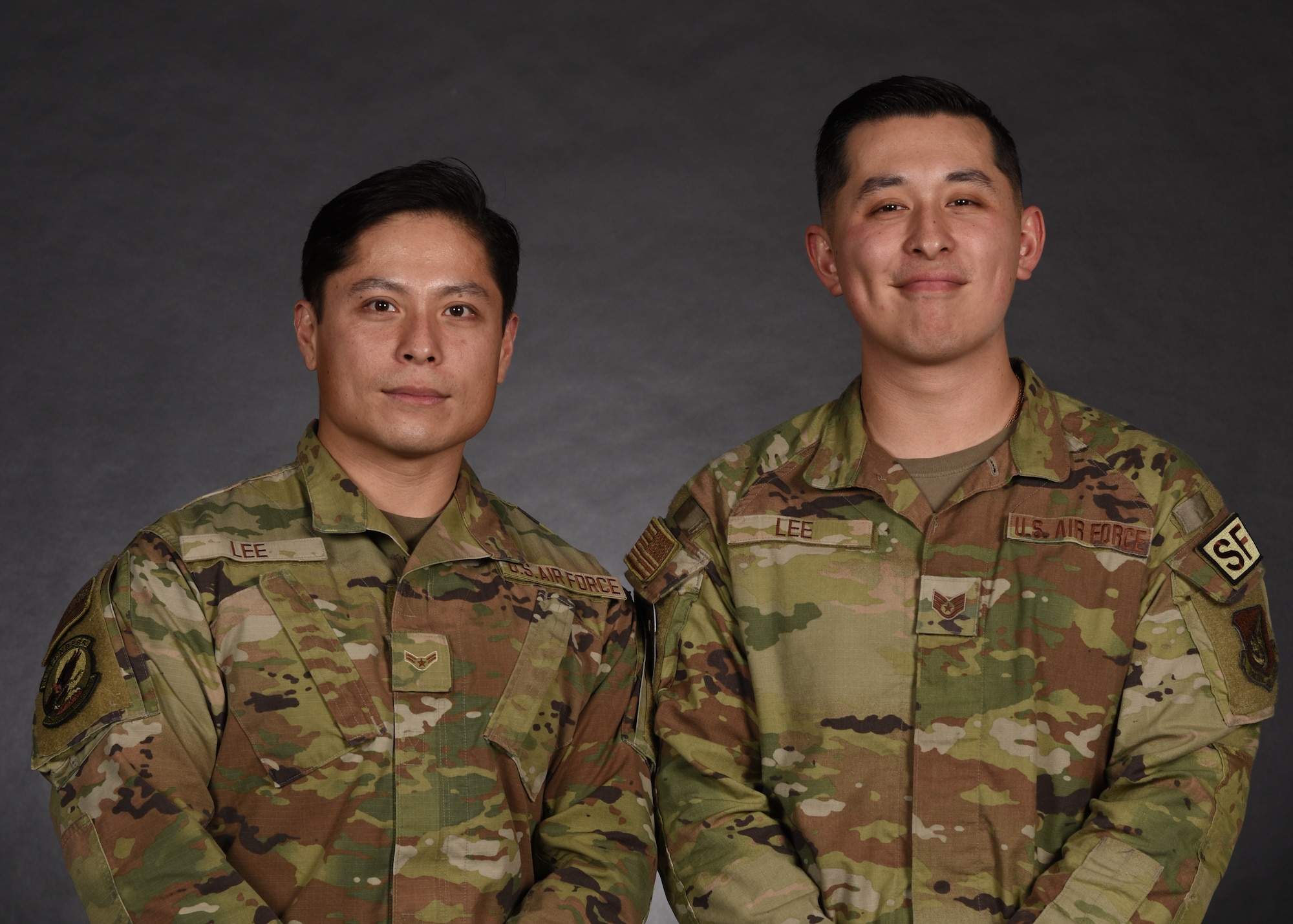 Airman 1st Class Dae Lee, left, 374th Security Forces Squadron patrolman, and Staff Sgt. Ja Lee, 374th SFS combat arms instructor, pose for a photo at Yokota Air Base, Japan, April 1, 2022.
