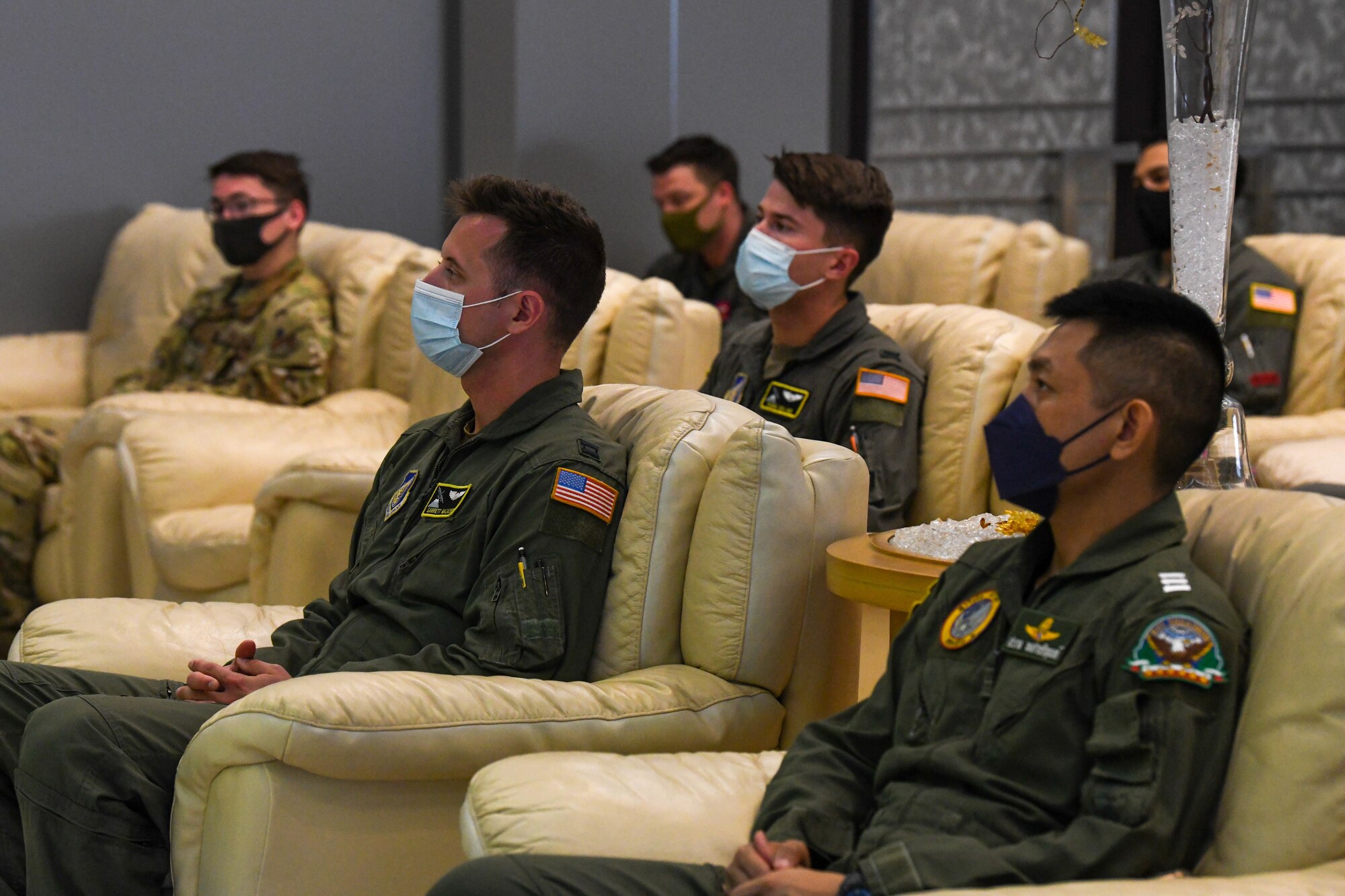 Airmen listen to a briefing
