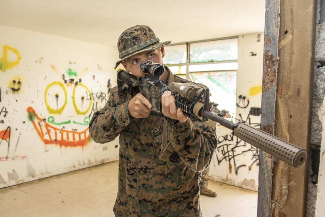 U.S. Marine Lance Cpl. Chris Meinershagen, a mortar Marine with Battalion Landing Team 1/5, 31st Marine Expeditionary Unit (MEU), holds security during room clearing drills at Barrigada, Guam, Mar. 21, 2022. Exercise Noble Arashi is part of 31st MEU's Noble Series of exercises which are used to validate or invalidate the Family of Naval Concepts, develop techniques and procedures for the employment of MEU assets in support of sea denial and fleet maneuver, and inform future force design and experimentation efforts.