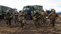 U.S. Navy corpsman with Combat Logistics Battalion 31, 31st Marine Expeditionary Unit (MEU) compete against Japanese Ground Self-Defense Force (JGSDF) medics with the Amphibious Ready Deployment Brigade to place a tourniquet on a casualty on Combined Arms Training Center Camp Fuji, Shizuoka Prefecture, Japan, Mar. 21, 2022. The corpsmen and medics worked together to set up a shock trauma platoon, which enables the quick stabilization of casualties in a field environment.