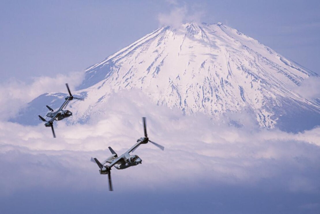 A U.S. Marine Corps MV-22B Osprey with Marine Medium Tiltrotor Squadron 265 (Reinforced), 31st Marine Expeditionary Unit, and a Japanese Ground Self-Defense Force V-22 Osprey with the 107th Aviation Unit conduct a bilateral formation flight over Mount Fuji, Japan, Mar. 17, 2022. Bilateral flights build familiarity and interoperability between U.S. and Japanese aviation units.