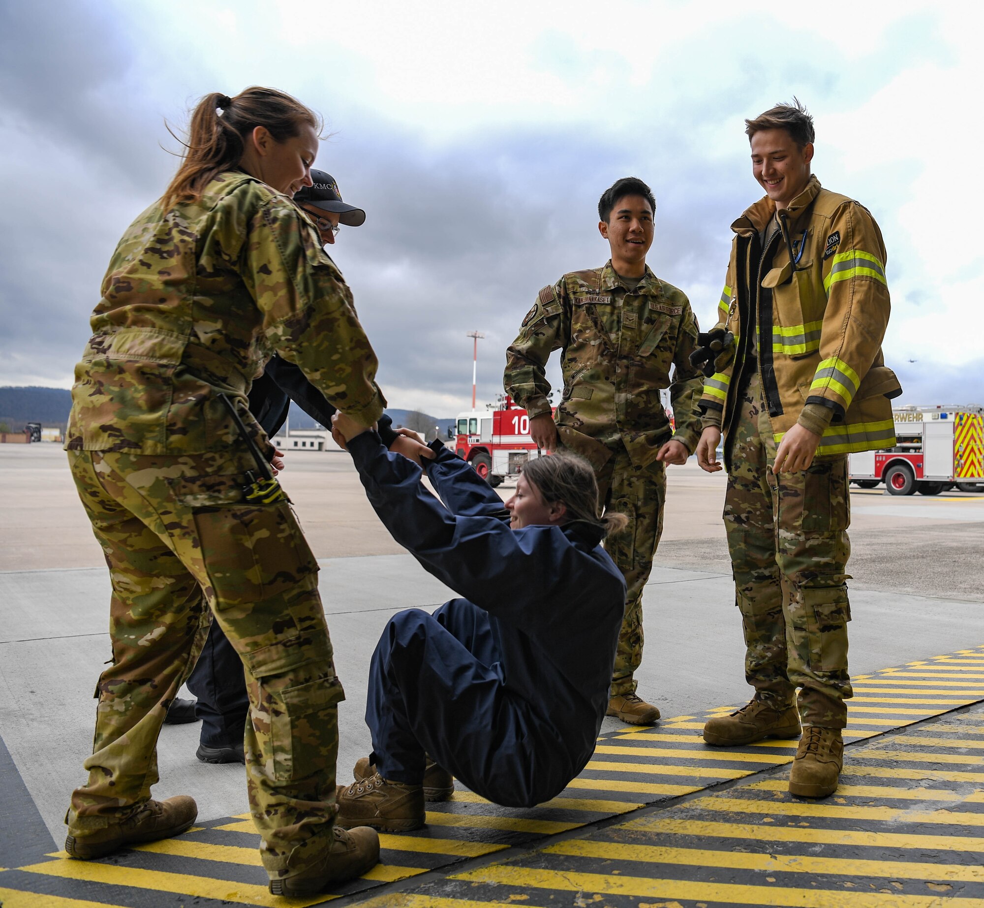 Airmen assigned to Ramstein Air Base, Germany, complete an annual aircraft fuel tank extraction exercise on April 6, 2022. This exercise simulated a situation where an Airmen with proper qualifications to perform maintenance on a fuel tank, also known as an entrant, became unresponsive and needed to be extracted and brought to safety. (U.S. Air Force photo by Airman 1st Class Jared Lovett)