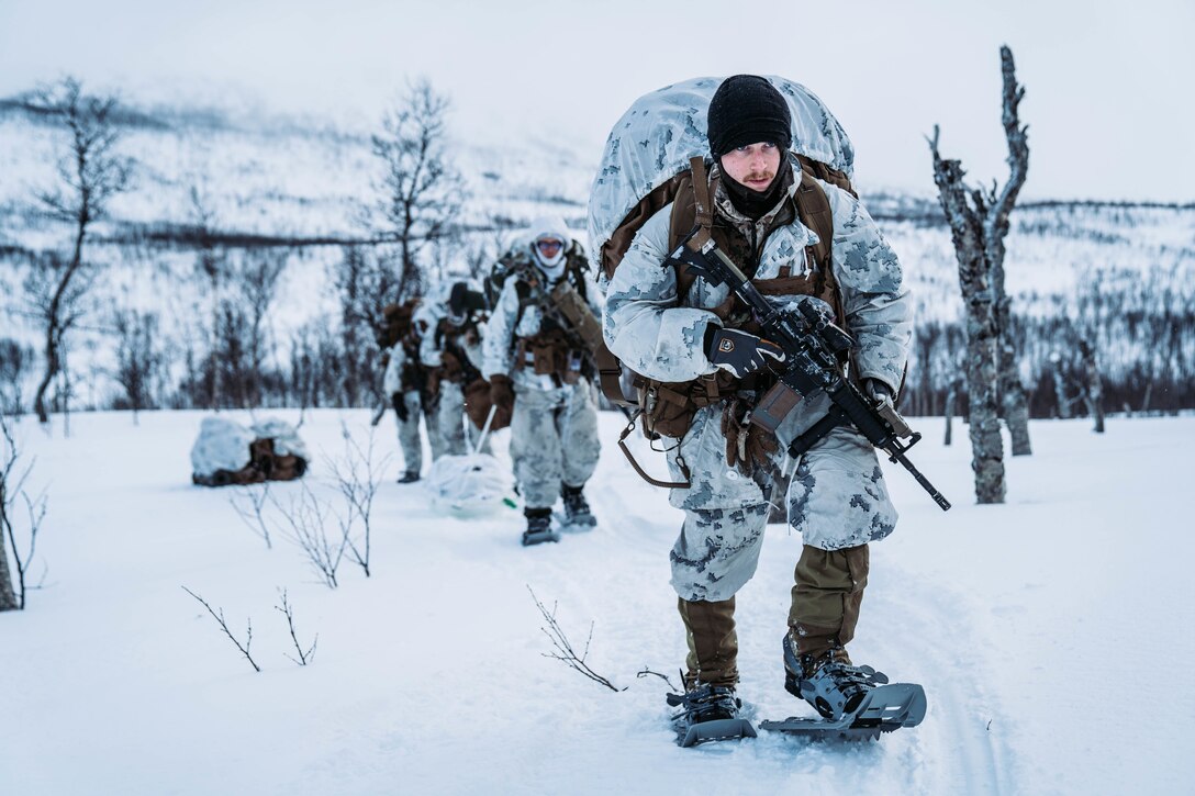 U.S. Marines with Jaeger (Hunter) concept platoon, 3rd Battalion, 6th Marine Regiment, 2nd Marine Division, hike to a hide site position prior to Exercise Cold Response 22 in Setermoen, Norway, March 3, 2022. Exercise Cold Response 22 is a biennial Norwegian national readiness and defense exercise that takes place across Norway, with participation from each of its military services, including 26 North Atlantic Treaty Organization (NATO) allied nations and regional partners. (U.S. Marine Corps photo by Sgt. William Chockey)