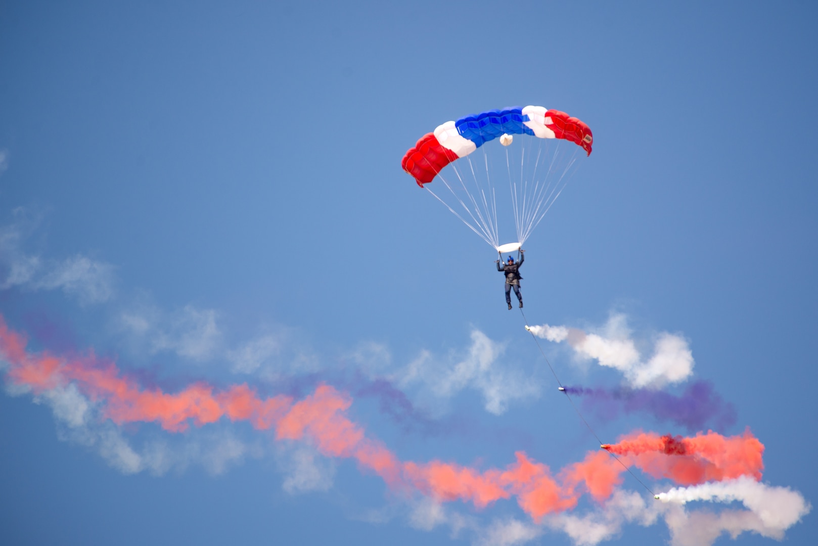 The U.S. Air Force Academy Wings of Blue Parachute Team performs jumps during Chile’s Feria Internacional del Aire y Espacio (FIDAE) April 5, 2022, in Santiago, Chile.