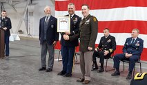 David Tate, Purdue University ROTC Hall of Fame chair, inducts Col Brian M. Moore, acting director of the U.S. Army Space and Missile Defense Center of Excellence, into the 2021-2022 Purdue University, Indiana, ROTC Hall of Fame during a ceremony, April 9, at the Purdue Armory. (courtesy photo)