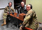 From left, Senior Airman Ashtin Steen, Staff Sgt. Chris Wood and Tech. Sgt. Sean Wood of the 157th Maintenance Squadron, 157th Air Refueling Wing, New Hampshire Air National Guard, mic up for a podcast episode of Your NH Guard on March 2, 2022, at Pease Air National Guard Base in Newington, New Hampshire. (Photo by Tech. Sgt. Charles Johnston)