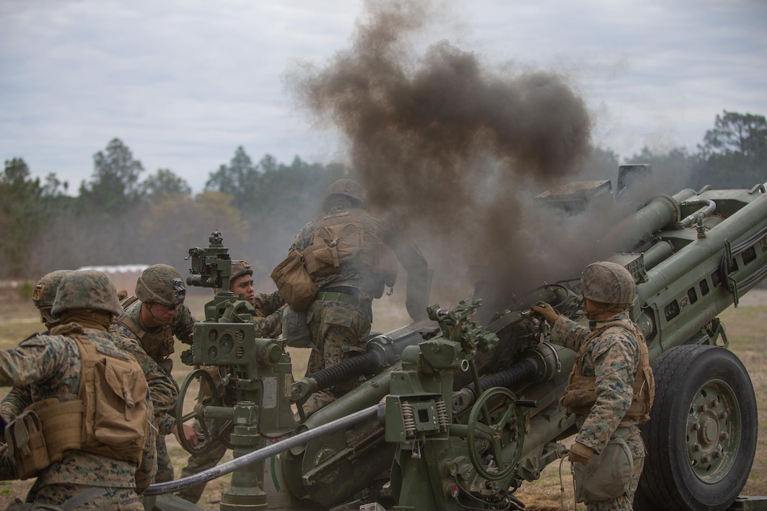 U.S. Marines with Echo Battery, 2d Battalion, 10th Marine Regiment, 2d Marine Division, operate an M777 howitzer during Exercise Rolling Thunder 22-2 on Fort Bragg, North Carolina, March 29, 2022. This exercise is a 10th Marines-led live fire artillery event that tested the unit’s abilities to operate in a simulated littoral environment against a peer threat in a dynamic and multi-domain scenario. (U.S. Marine Corps photo by Lance Cpl. Ryan Ramsammy)