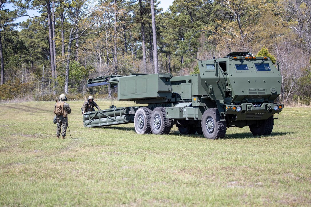 U.S. Marines with 10th Marine Regiment load a reduced range practice rocket in a M142 High Mobility Artillery Rocket System during Exercise Rolling Thunder 22-2 on Camp Lejeune, North Carolina, April. 4, 2022.