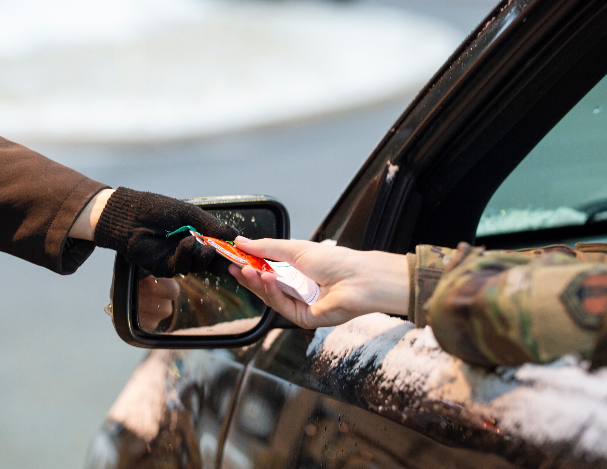 U.S. Air Force Col. Michael Piontek, Vice Commander of the 133rd Airlift Wing, and Krista Sheridan, 133rd Airlift Wing’s Sexual Assault Response Coordinator hand out information about sexual assault awareness and prevention month in St. Paul, Minn., April 8, 2022.