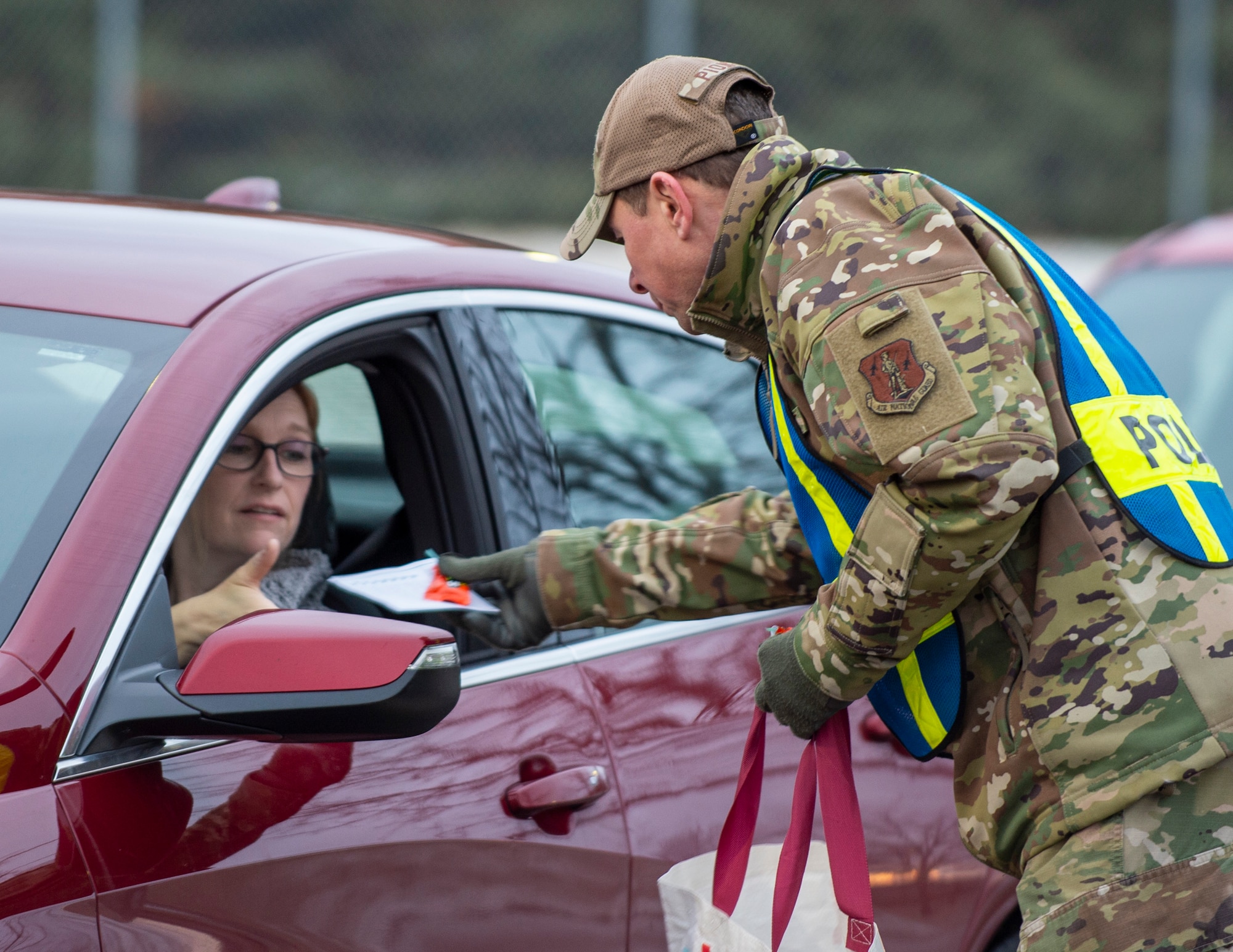 U.S. Air Force Col. Michael Piontek, Vice Commander of the 133rd Airlift Wing, and Krista Sheridan, 133rd Airlift Wing’s Sexual Assault Response Coordinator hand out information about sexual assault awareness and prevention month in St. Paul, Minn., April 8, 2022.