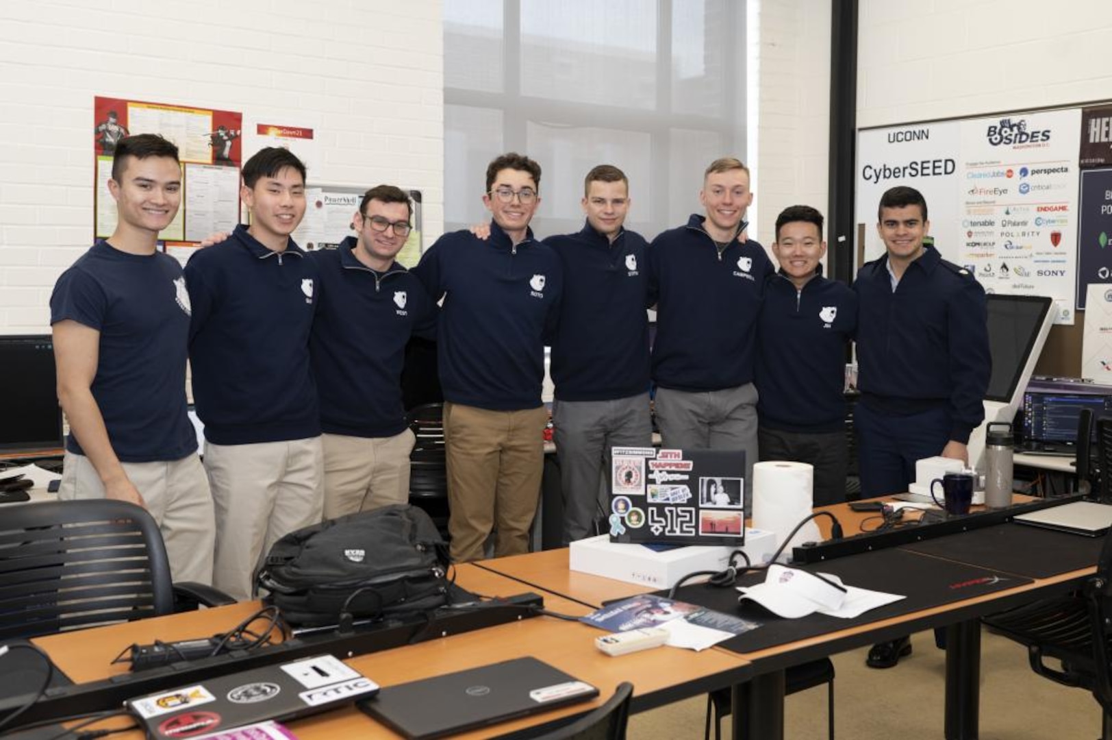 A U.S. Coast Guard Academy cadets, members of the Academy's cyber team, pose for a group photo while participating in the National Security Agency's (NSA) annual cyber exercise (NCX), here, Apr. 1, 2022. The Academy's cyber team won third place out of 12 total teams. (U.S. Coast Guard photo by Petty Officer 3rd Class Matthew Abban)