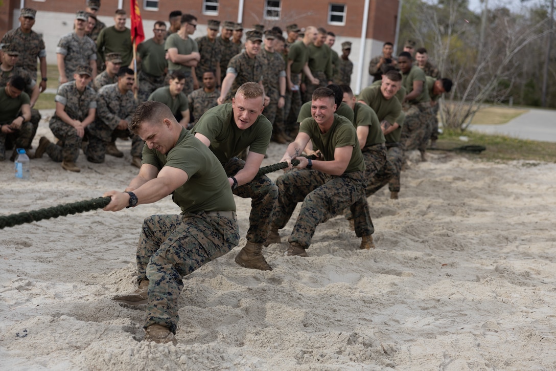 U.S. Marines with 2d Battalion, 2d Marine Regiment (2/2), 2d Marine Division, participate in tug-of-war during the Warlord Games II on Camp Lejeune, North Carolina, March 31, 2022. The Warlord Games is a quarterly event where Marines from 2/2 compete in various competitions to strengthen the unit's esprit de corps. (U.S. Marine Corps photo by Lance Cpl. Deja Thomas)