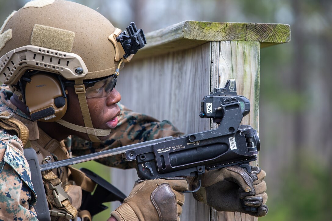 A U.S. Marine with 3rd Battalion, 6th Marine Regiment, 2d Marine Division, aims a M320 Grenade Launcher on Camp Lejeune, North Carolina, April 5, 2022.
