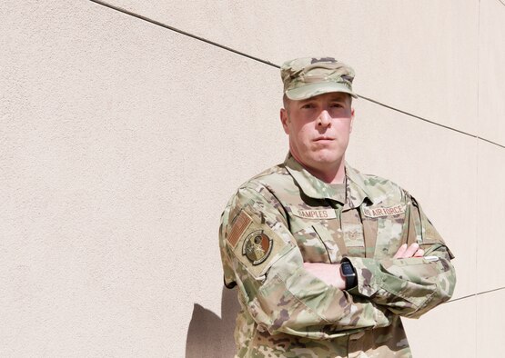 U.S. Air Force Tech. Sgt. Joshua Samples, the noncommissioned officer in charge with the 50th Contracting Squadron’s Rapid Construction Team, shields his eyes from the bright Centennial State sun while posing for a photo on April 5, 2022 at Schriever Space Force Base, Colorado.