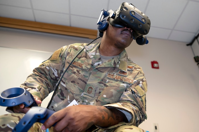 U.S. Air Force Chief Master Sgt. Mark Moore, 492d Special Operations Training Group senior enlisted advisor, goes through a virtual reality simulation as part of an Air Force Integrated Technology Platform Virtual Reality demonstration, April 5-6, at Hurlburt Field, Florida.